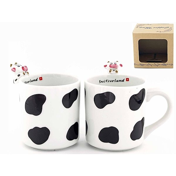 Kaffeetasse mit Kuh auf dem Tassenrand