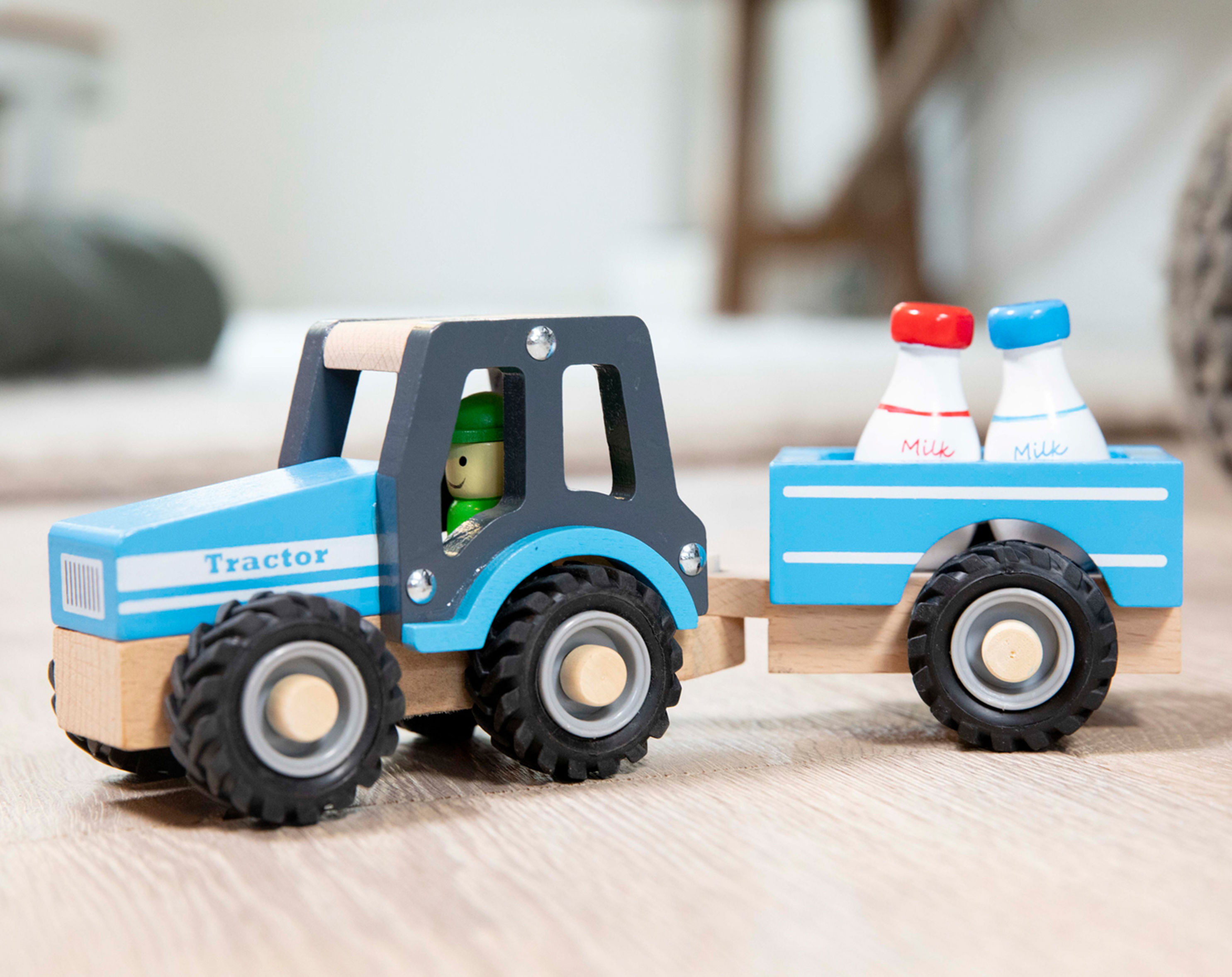 New Classic Toys Holz-Traktor Milchtransport, 4-teilig kaufen