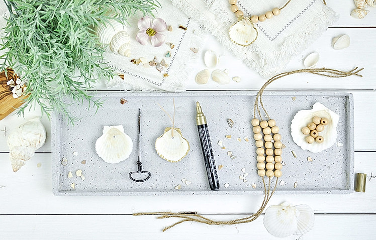 DIY-Anleitung für maritime Serviettenringe aus Holzperlen und Muscheln